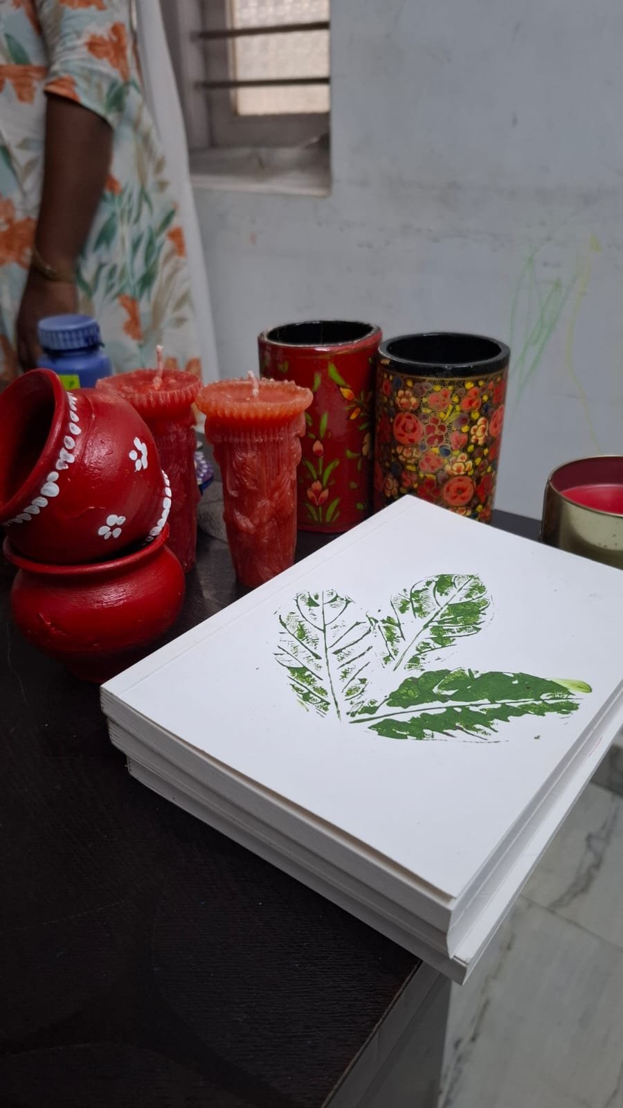 Learners participating in a guided leaf-printing activity