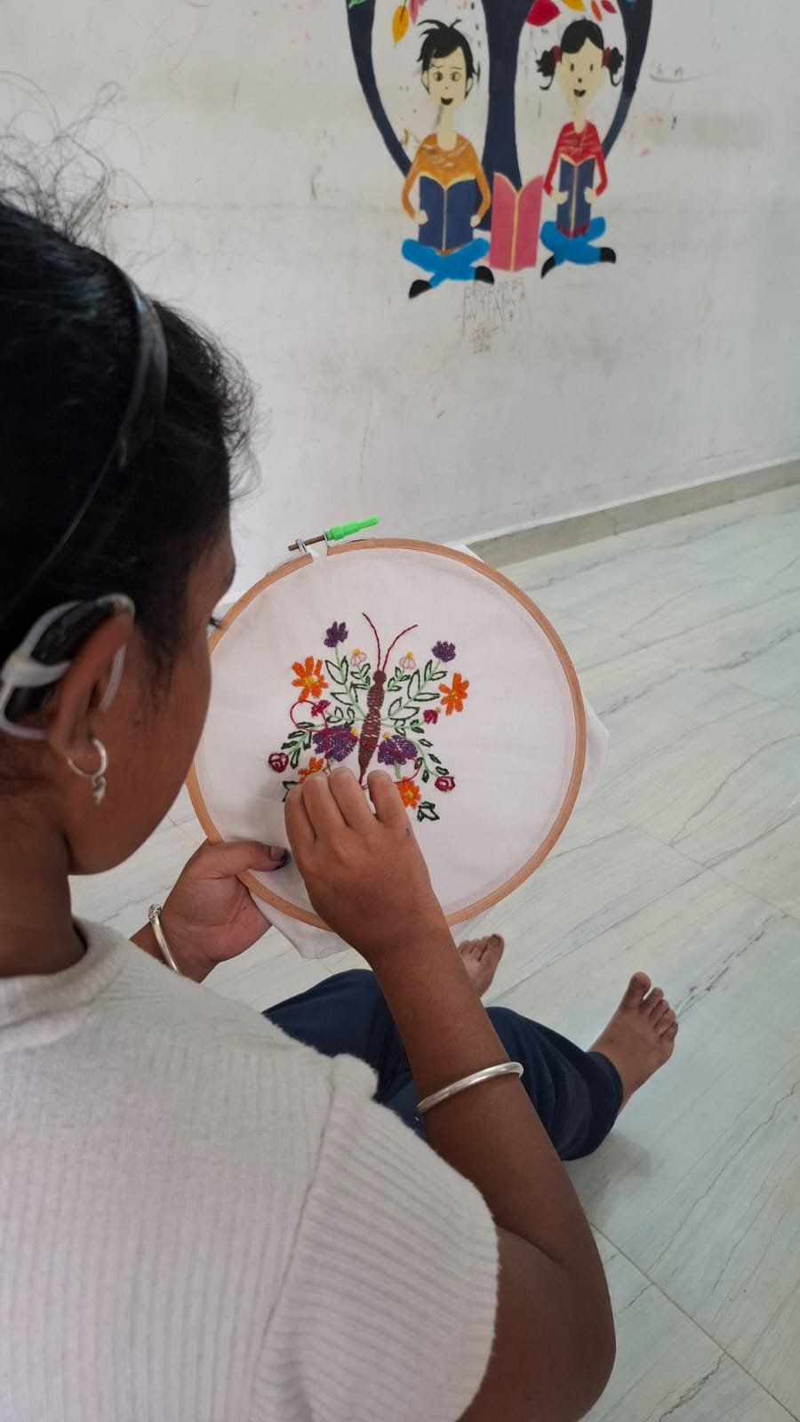 Learner completing detailed embroidery work